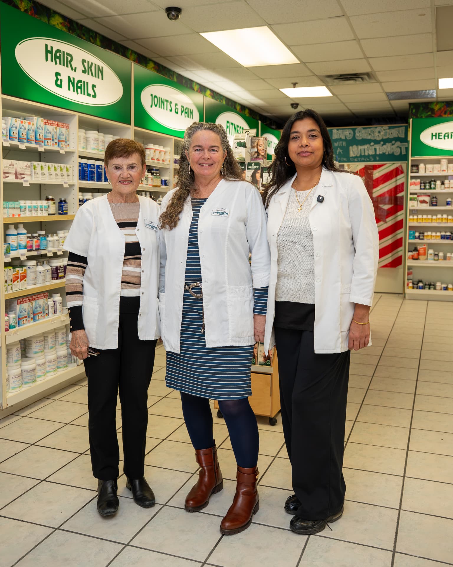 Three Good Health Mart staff members in store